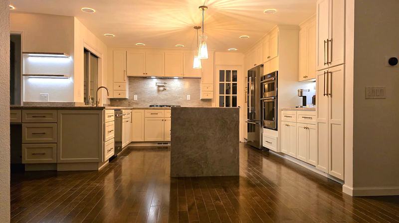The finished kitchen in the evening with under-shelf lighting